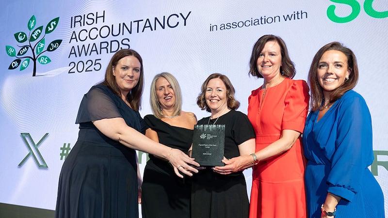 Paula Egan, head of sales UKI, Sage, presents the payroll team of the year - large award to Azets Ireland team