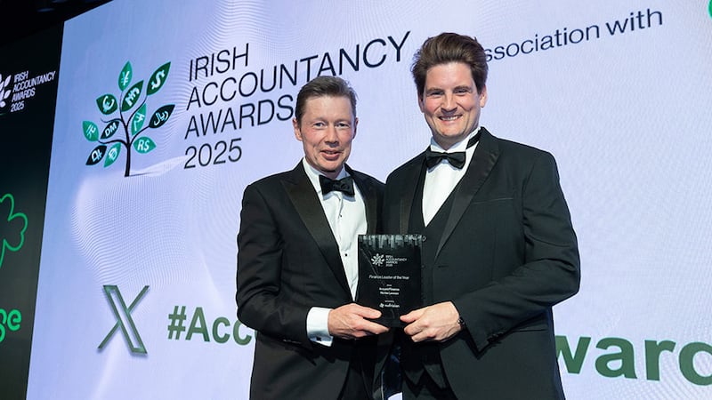 Feargal Brady, chief executive, No Frixion presents the finance leader of the year award to Richie Lennon, Around Finance