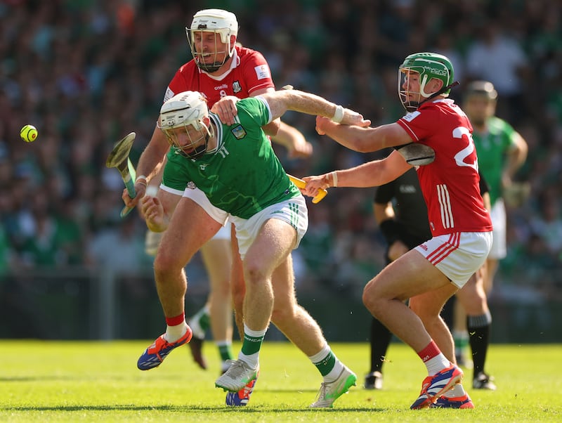 Cork’s Tim O'Mahony and Brian Roche struggle for possession with Cian Lynch of Limerick. Photograph: James Crombie/Inpho