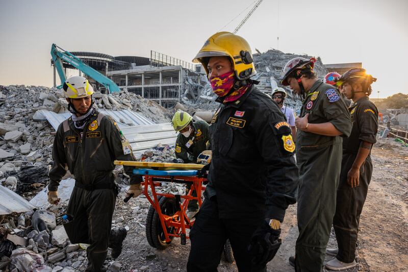 Thai rescue teams provide aid at a construction building collapse in Bangkok's Chatuchak area. Photograph: Lauren DeCicca/Getty Images